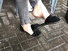 Glamorous Woman Caught Dangling Her Black Sandals In Public