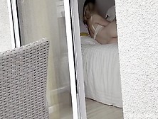 Hot Spaniard Was Secretly Filmed In Her Hotel Room Through The Window As She Took Nude Pictures