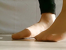 Tan Stockings Feet And White Nails