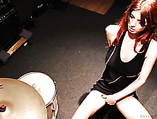 Gorgeous Redhead In A Black Dress Does Some Pleasurable Things With Her Arm To Make Her Pussy Wet In An Instrumental Room