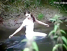 Girl Gets Wet In Creek In Riding Attire