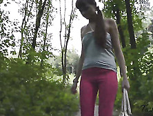 Crazy Brunette In Sexy Tight White Top Holds Her Bag And Wears Her Pink Leggings And Pees Out In The Woods