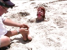 Kinky Dude Tortures And Tickles A Sexy Redhead's Feet On The Beach