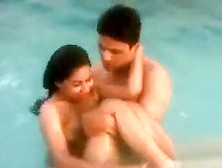 Skinny Dipping Girl And Her Man In The Pool