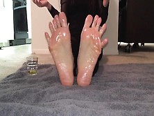 Bored Amateur Babe Oils Up Her Sensitive Feet And Toes On The Carpet Close Up