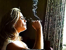 Mature Maven With Sexy Feet Is Seated For A Sensual Smoke Session.