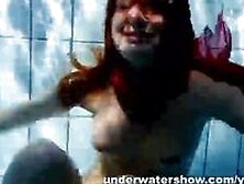 Redhead Mia Stripping Underwater