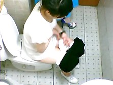 Two Pretty Asian Friends Are Pissing On Toilet In Café
