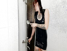 Fetish Of Latex And Rubber.  Dominatrix Nika Takes A Shower In A Latex Dress.