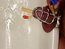 Pissing With Catheter Locked In Chastity Cage