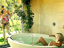 Glamorous Lesbian Babe Getting Drilled With A Strap On Dildo In A Bath Tub