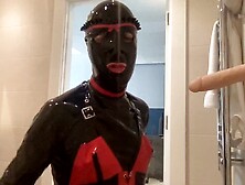 Latex Alice Gives A Sloppy Blowjob To A Dildo On Her Knees In The Shower