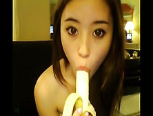 Asian Girl With A Banana