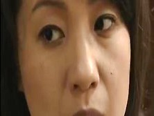 Mature Asian Grouped In Front Of Husband