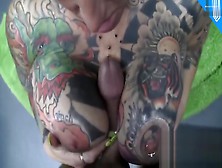 Pierced Tattooed Mature Sucks Cock