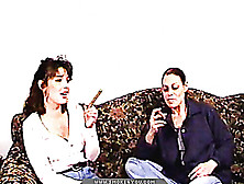 Ponytailed Brunette Smoking A Cigarette And Her Friend Prefers Cigars