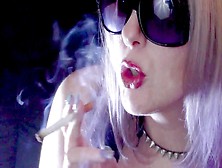 Closeup Of Blonde Woman Smoking A Cigarette