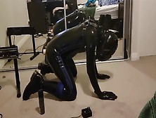 Caged Latex Gimp Testing Out A New Fucking Machine