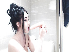 Pulverizes Herself With A Strap On Dildo In The Bathtub