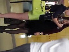 Asian Woman In Green Short Skirt
