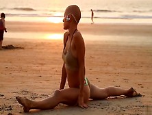 Bald Beauty Doing Yoga By The Sea