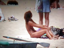 Horny Naked Brunette Woman Teasing Her Mates On The Beach