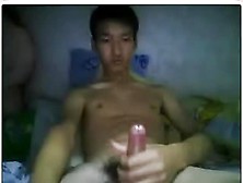 Good-Looking Thai Teen Masturbating On His Bed