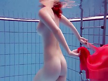 Redhead Dancing In The Pool
