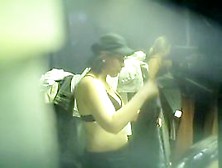 Spy Cam Chick In Cap Without The Top In Dressing Room