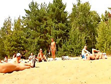 Wives And Their Husbands Sunbathing At The Nudist Beach