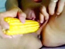 Chick Sticks Corn In Cunt