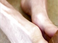 Naughty Guy Is Practicing Some Footjob Skills On A Dildo