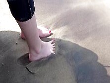 Hot Little Red Toes In The Sand At The Lake.