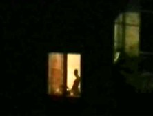 Horny Couple Caught Playing At Open Window