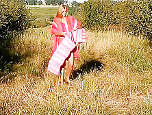 Breathtakingly Beautiful Girl Undresses On A Meadow