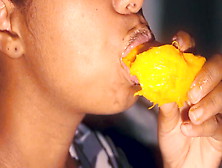 Sexy Mouth Ebony Playing With A Mango