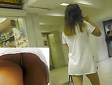 Dark-Haired Babe Caught On The Upskirt Camera