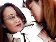 Office Lady With Glasses Kissing Getting Her Face Licked By Schoolgirl On The Couch In The Room