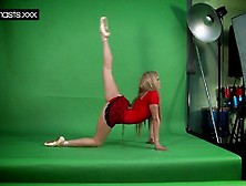 Cute Red Dressed Gymnast Doing Spreads