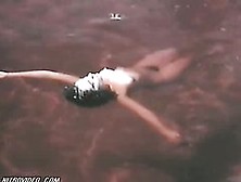 Delia Casanova Floating Naked In The Water