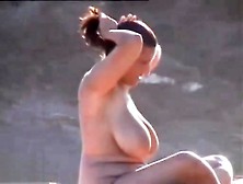 Busty Nudist Woman At Beach