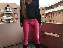 Wetting Pink Pants On Balcony
