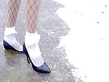 High Heels And White Frilly Socks In The Snow