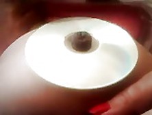 Chubby Girl Bellybutton Stuffing Into A Cd