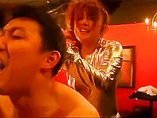 Escort Girl In Shiny Outfit Pegging Business Man