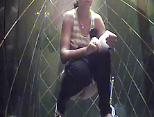 Hot Brunette Is Pissing In The Public Toilet