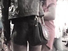 Candid Black Butt In Leather Shorts