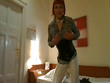 Tranny In White Pvc Is Waiting In Hotel Room