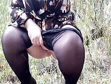 Milf Inside A Short Skirt Peeing With Stockings Put Down Near The River