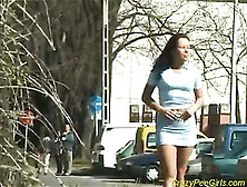 A Pretty Hot European Babe Pissing In Public